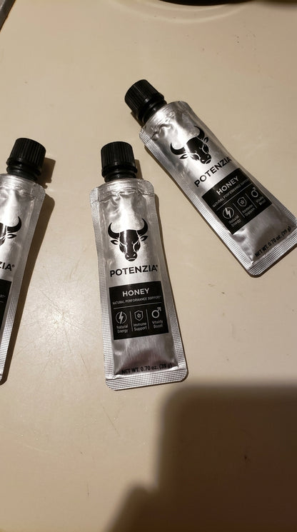 Three Potenzia Honey sachets on a counter